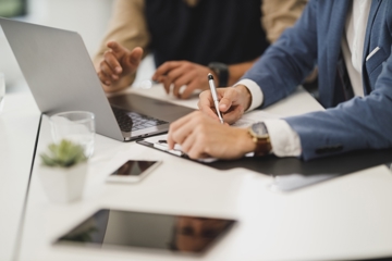 two people working at a desk together
